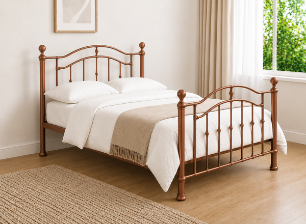 Double copper metal bed frame with curved headboard and footboard.