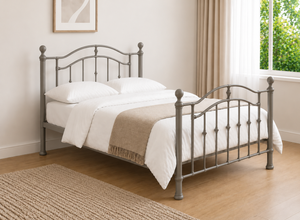 Double silver metal bed frame with curved headboard and footboard.