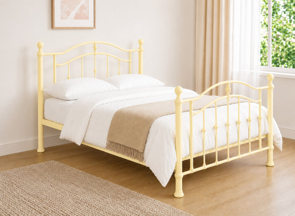 Double light pink metal bed frame with curved headboard and footboard.