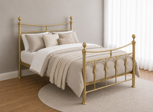 Gamford Double Metal Bed Frame in Gold with decorative finials and curved headboard.