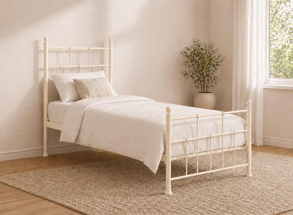 Small Double Levington metal bed frame in light pink with a classic spindle design.