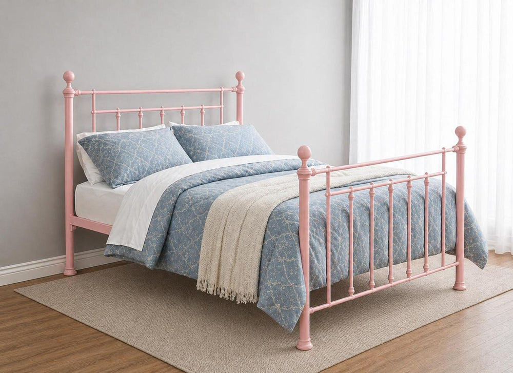 Libham Double Metal Bed Frame in Sage Green with decorative finials and a patterned duvet.