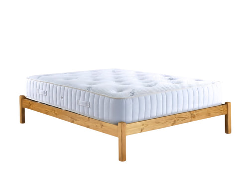 Eco mattress sitting on a wood frame